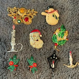 Vintage Christmas pins and clip earrings.